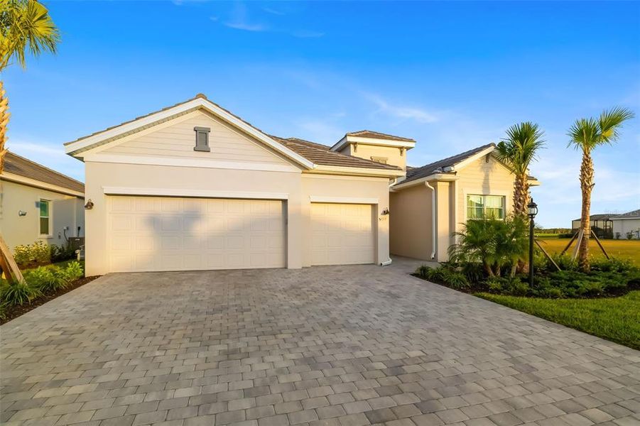 Front exterior of a new home in , Lakewood Ranch, FL, highlighting curb appeal (Image 24).