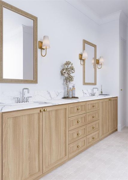 Bathroom with double vanity, crown molding, and tile patterned floors