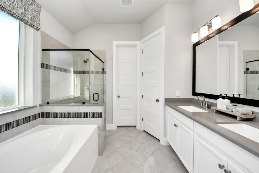 Furnished interior view inside a new home in Sunterra: Premier Collection, Katy (Image 11).