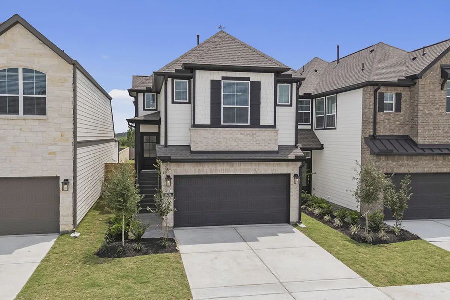 Front exterior of a new home in Bridgeland Chateaus, Cypress, TX, highlighting curb appeal (Image 19).