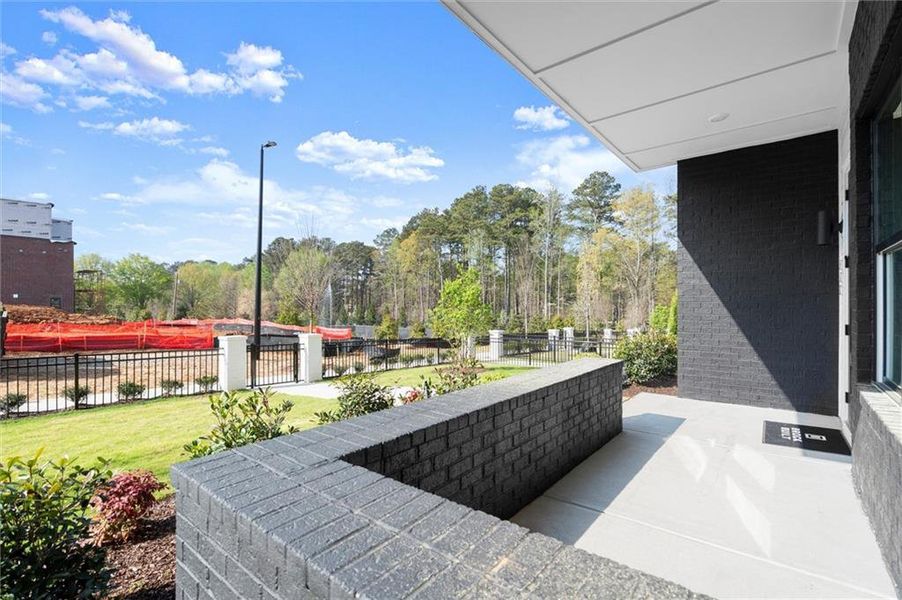 Exterior details and patio area of a home in The Gathering Alpharetta, Alpharetta (Image 30).