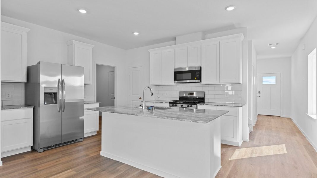 Representative furnished interior of a home built from the Hanna by D.R. Horton in Caldwell Crossing, Iowa Colony (Image 7).