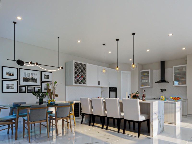 Bright, open-concept kitchen and dining area featuring a waterfall-edge island, custom cabinetry and designer pendant lighting.