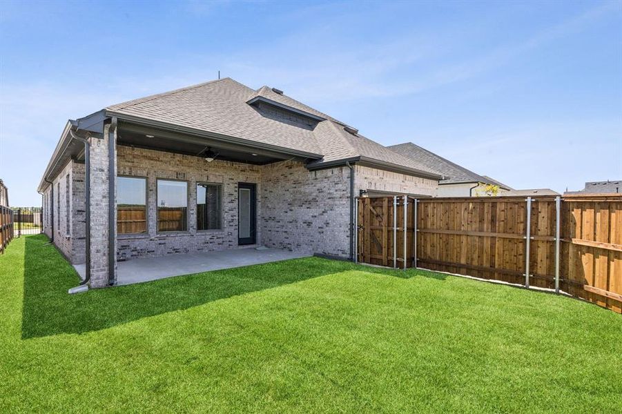 Front exterior of a new home in Talia, Mesquite, TX, highlighting curb appeal (Image 1).