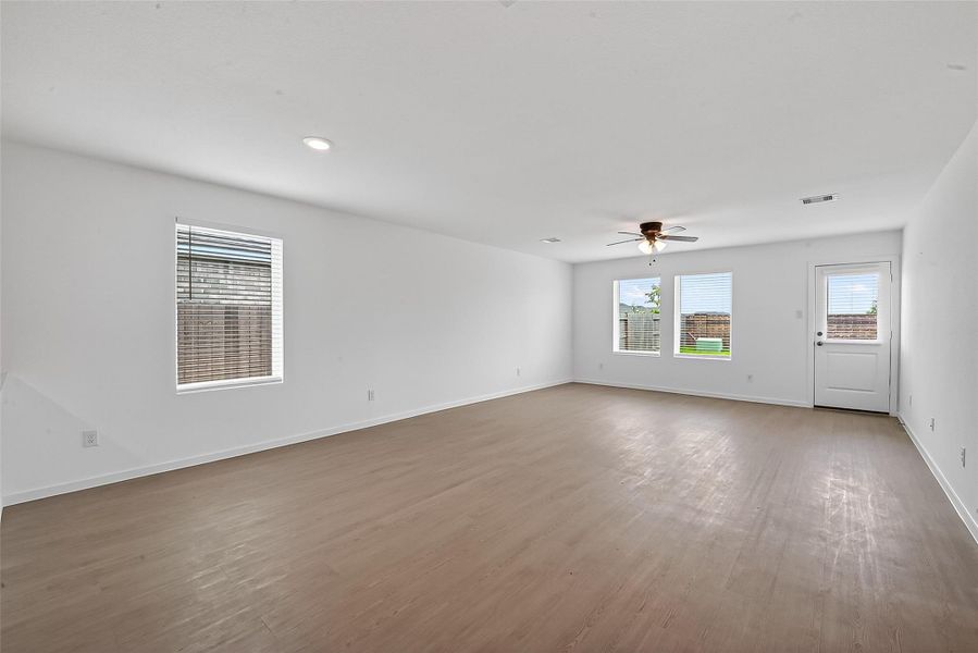 The home revolves around the spacious open living room with ample natural light!