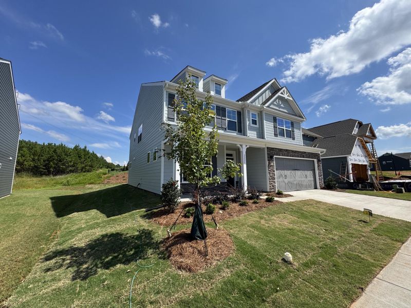 Front exterior of a new home in The Enclave at Laurelbrook, Sherrills Ford, NC, highlighting curb appeal (Image 2).