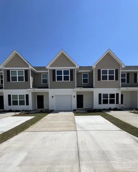 Front exterior of a new home in Lexlee Estates, Pensacola, FL, highlighting curb appeal (Image 1). Front exterior of a new home in Lexlee Estates, Pensacola, FL, highlighting curb appeal (Image 1).