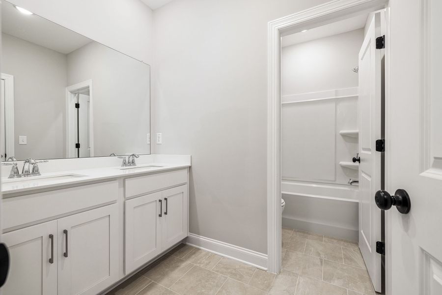 Dual vanities located in secondary bathroom upstairs