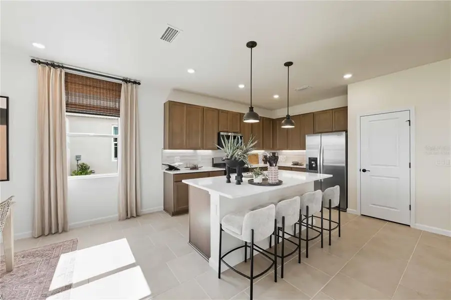 Furnished interior view inside a new home in Brystol North at Wylder, Port St. Lucie (Image 9).