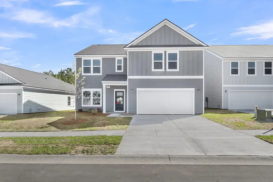 Front exterior of a new home in , Ravenel, SC, highlighting curb appeal (Image 17).