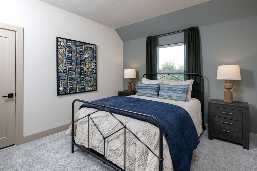 Your secondary bedroom features plush carpet, fresh paint, closet, and a large window that lets in plenty of natural lighting.