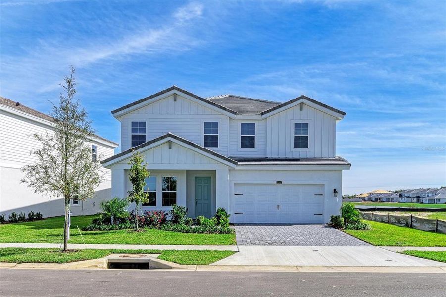 Front exterior of a new home in Mirada, San Antonio, FL, highlighting curb appeal (Image 1).