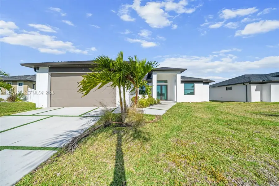 Front exterior of a new home in , Cape Coral, FL, highlighting curb appeal (Image 1). Front exterior of a new home in , Cape Coral, FL, highlighting curb appeal (Image 1).