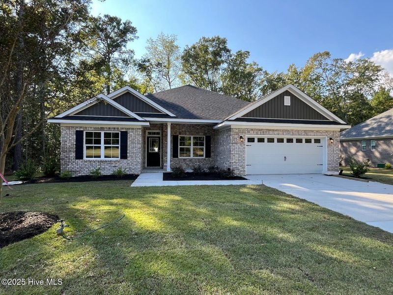 Front exterior of a new home in Palmetto Creek, Bolivia, NC, highlighting curb appeal (Image 1). Front exterior of a new home in Palmetto Creek, Bolivia, NC, highlighting curb appeal (Image 1).
