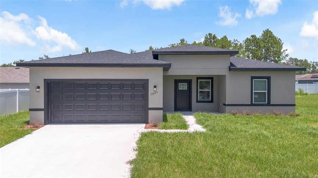 Front exterior of a new home in , Ocala, FL, highlighting curb appeal (Image 1). Front exterior of a new home in , Ocala, FL, highlighting curb appeal (Image 1).