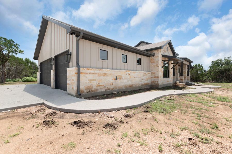 Front exterior of a new home in , Burnet, TX, highlighting curb appeal (Image 25). Front exterior of a new home in , Burnet, TX, highlighting curb appeal (Image 25).