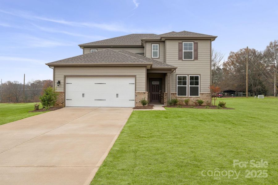 Front exterior of a new home in Running Creek, Locust, NC, highlighting curb appeal (Image 2). Front exterior of a new home in Running Creek, Locust, NC, highlighting curb appeal (Image 2).
