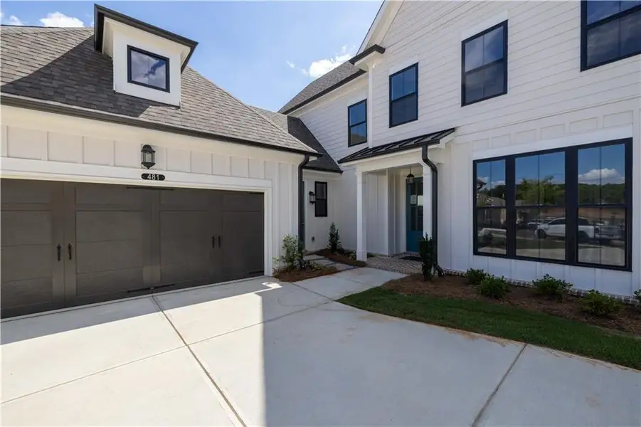 Exterior details and patio area of a home in Promenade at Sawnee Village, Cumming (Image 3).