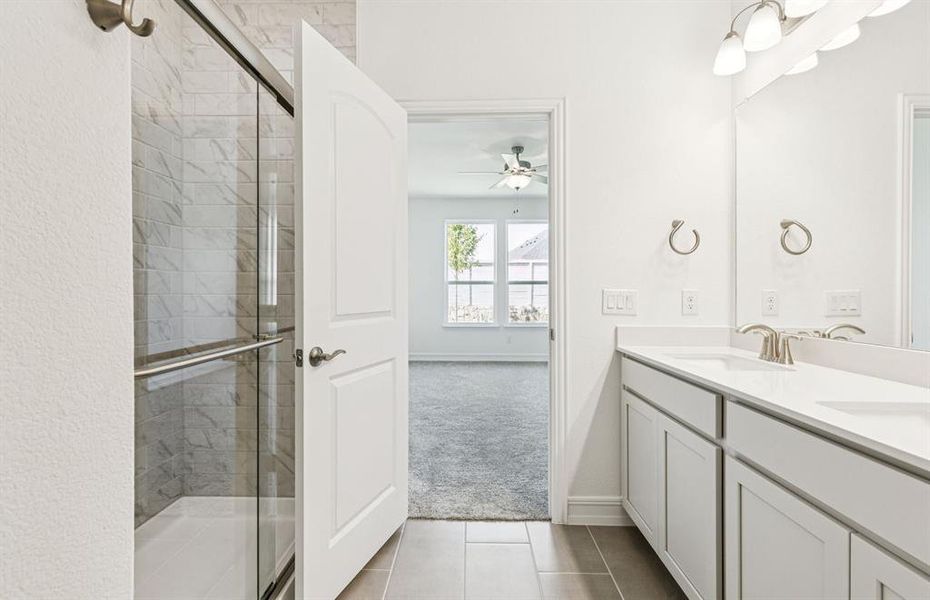 Owner's bath features double vanity and large shower Owner's bath features double vanity and large shower