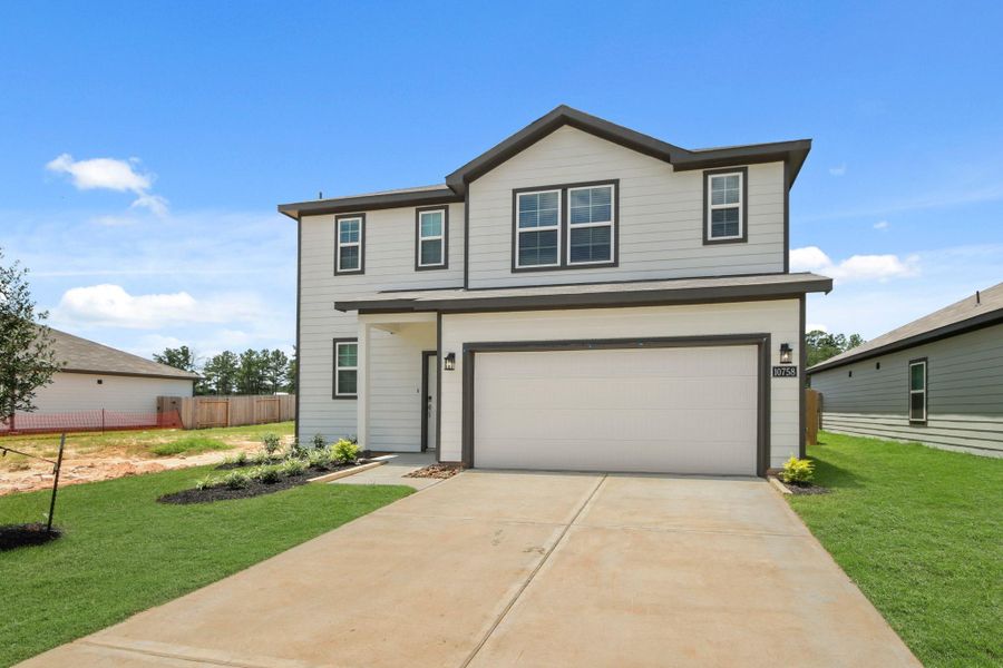 Front exterior of a new home in Crockett Meadows, Conroe, TX, highlighting curb appeal (Image 2).