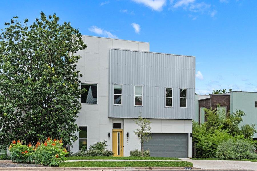 Front exterior of a new home in Agave, Austin, TX, highlighting curb appeal (Image 1).