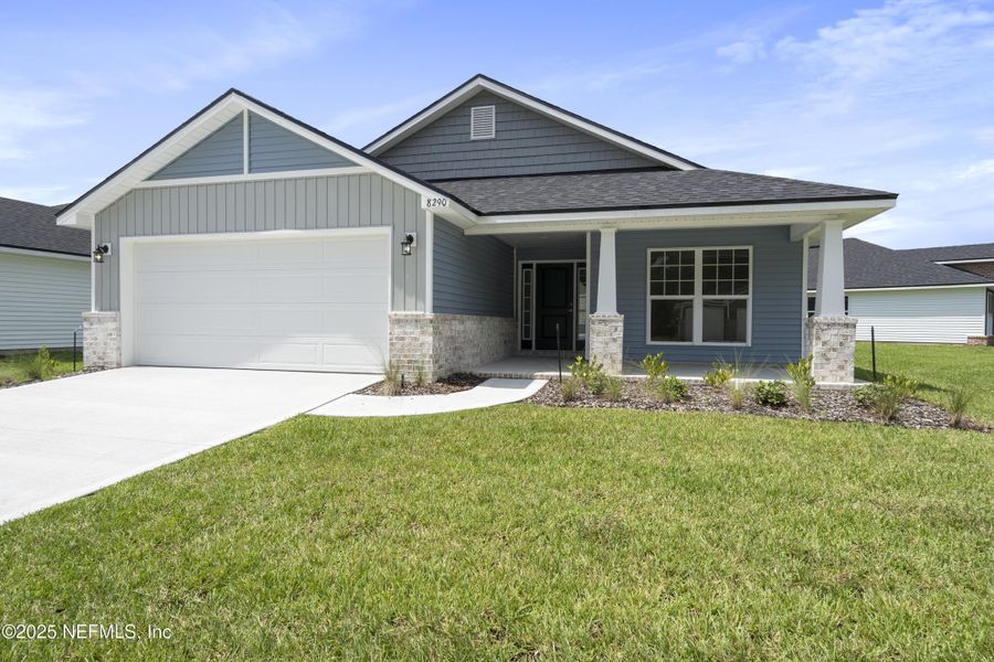 Front exterior of a new home in Summerglen, Jacksonville, FL, highlighting curb appeal (Image 14).
