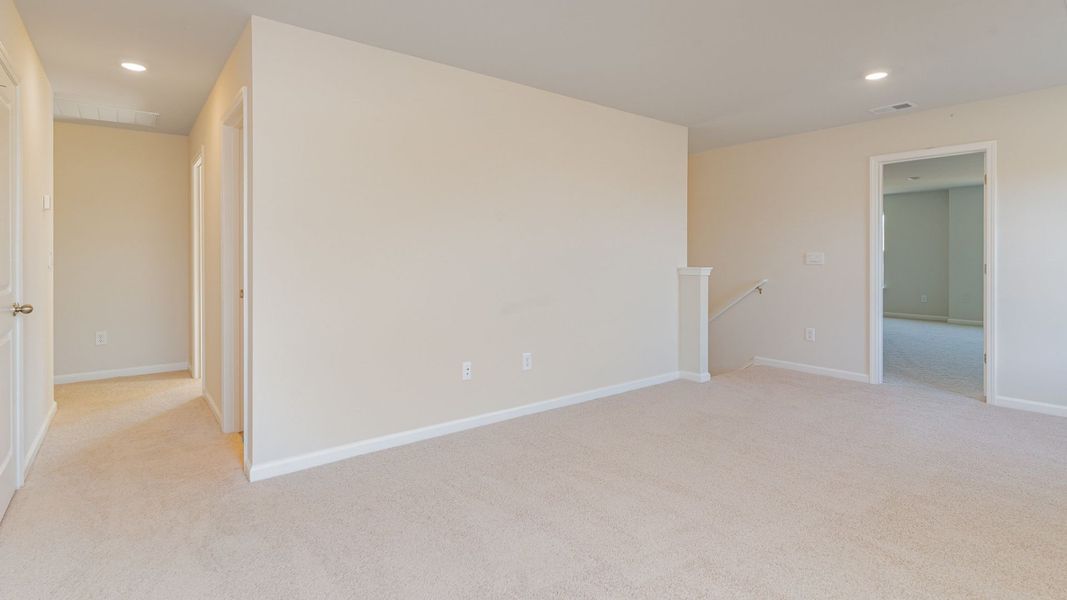Representative unfurnished interior of a home built from the WREN by D.R. Horton in Saltgrass Landing, Winnabow (Image 27).