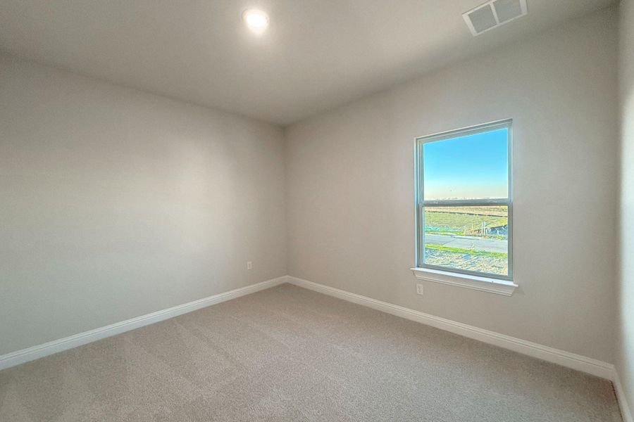 Unfurnished room with baseboards and carpet floors