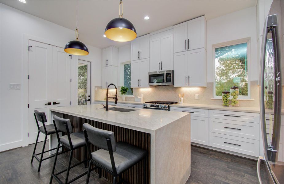 Large waterfall island with seating