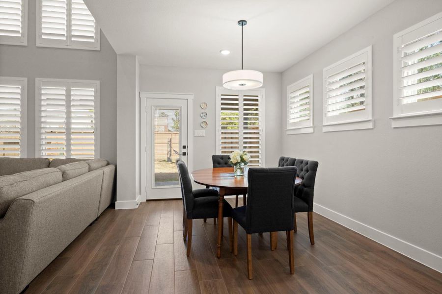 The dining area offers its own dedicated space while remaining open to the kitchen and living room. The dining area offers its own dedicated space while remaining open to the kitchen and living room.