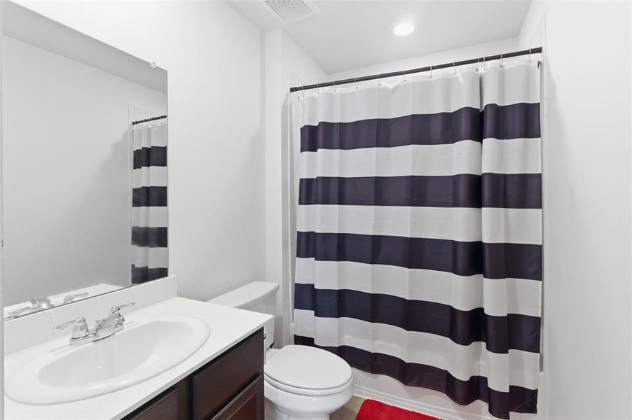 Full bathroom featuring vanity and toilet Full bathroom featuring vanity and toilet