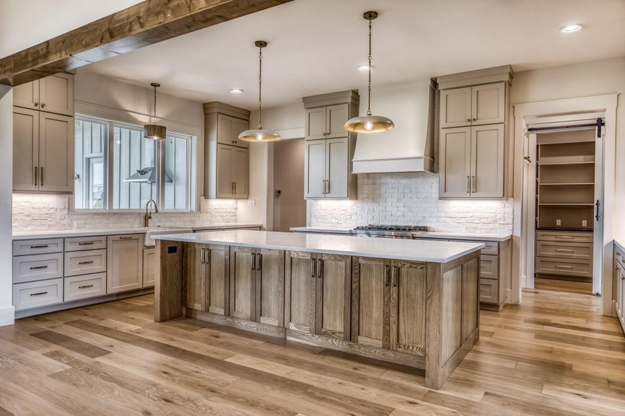 White oak stained custom cabinetry with quartz countertops