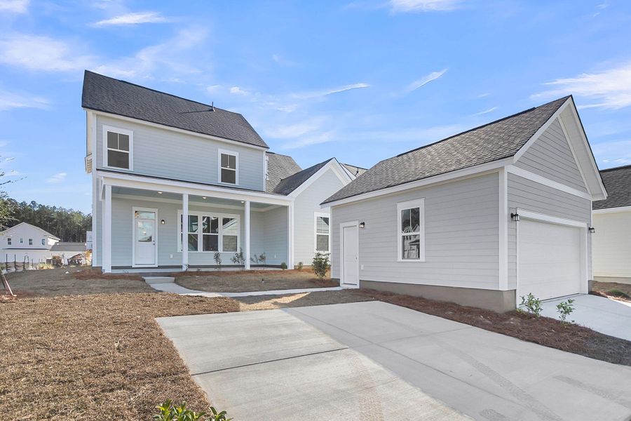 Front exterior of a new home in Midtown at Nexton, Summerville, SC, highlighting curb appeal (Image 1). Front exterior of a new home in Midtown at Nexton, Summerville, SC, highlighting curb appeal (Image 1).
