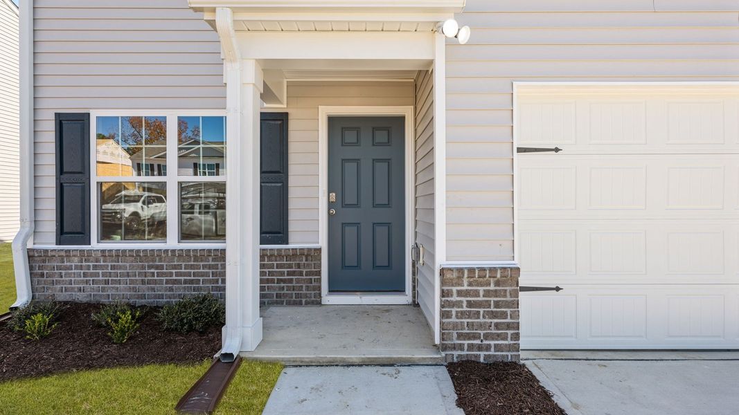 Exterior details and patio area of a home in Madeline Farm, New Bern (Image 3).