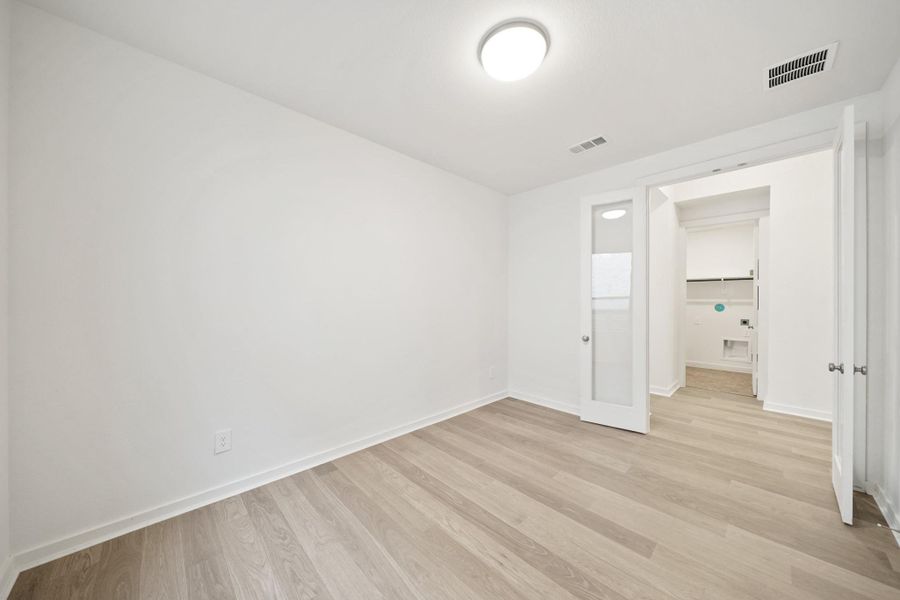 A stylish study featuring elegant French doors that offer both privacy and charm. A stylish study featuring elegant French doors that offer both privacy and charm.