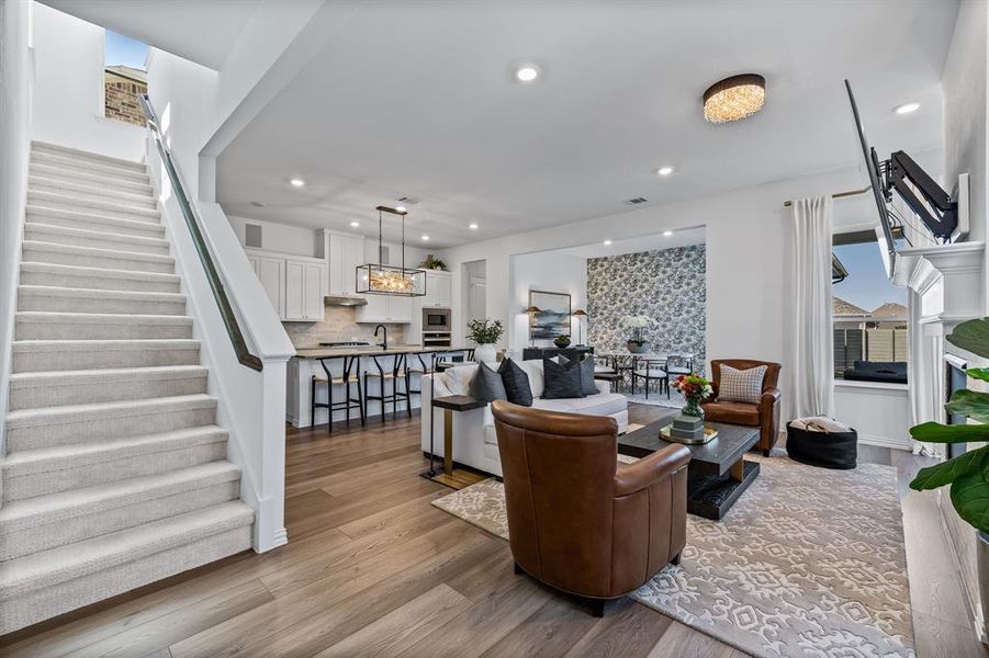 Living room featuring light hardwood / wood-style flooring and sink