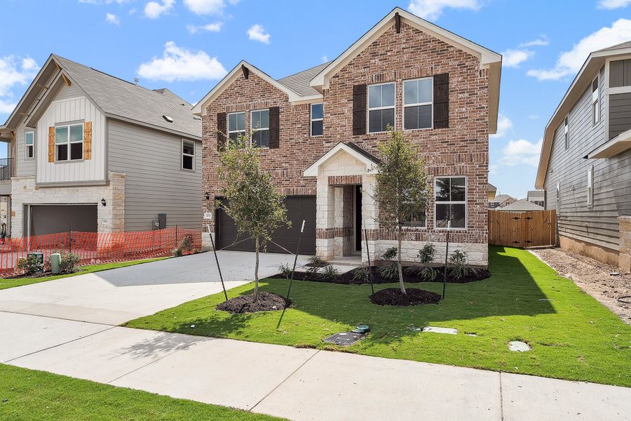 Representative exterior photo of a completed home built from the Blake by Ashton Woods in Rolling Glen, Hutto, TX (Image 2).