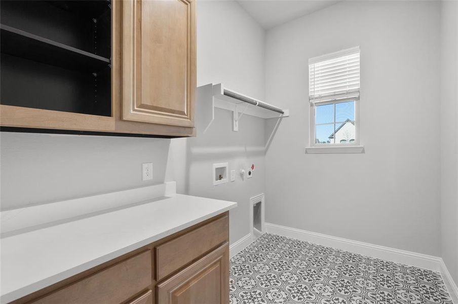 Large laundry with builtin cabinets