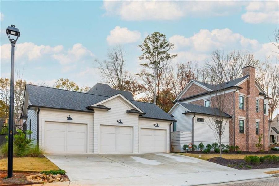 Front exterior of a new home in Barrington Place, Roswell, GA, highlighting curb appeal (Image 26). Front exterior of a new home in Barrington Place, Roswell, GA, highlighting curb appeal (Image 26).