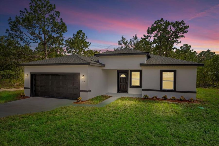 Front exterior of a new home in , Ocala, FL, highlighting curb appeal (Image 2). Front exterior of a new home in , Ocala, FL, highlighting curb appeal (Image 2).