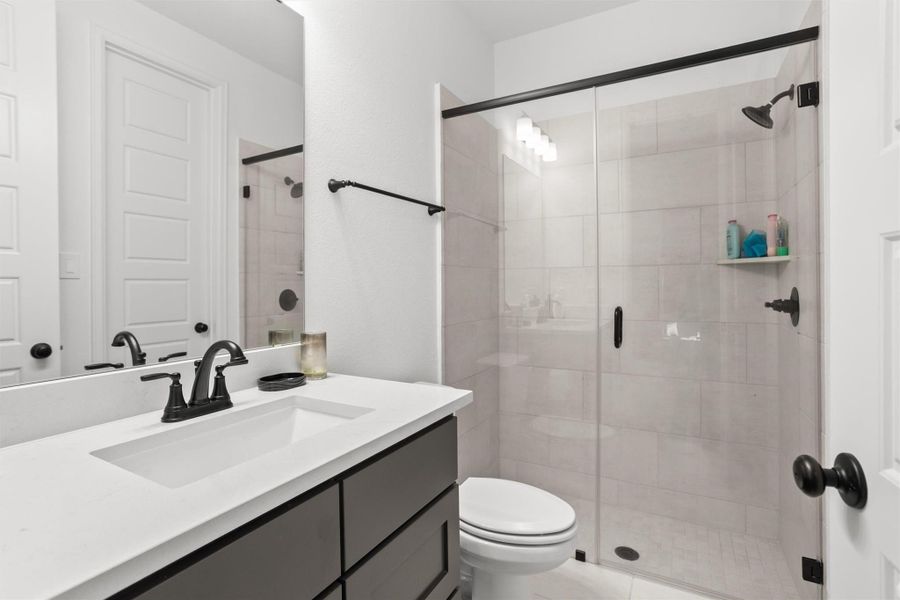 Private guest bath with glass-enclosed shower