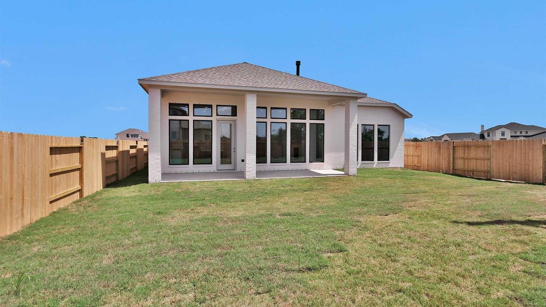 Exterior details and patio area of a home in Lakes of Cane Island, Katy (Image 3).