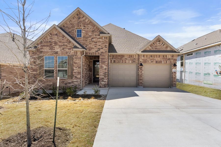 Representative exterior photo of a completed home built from the Sawgrass by Ashton Woods in Berry Creek Highlands, Georgetown, TX (Image 1). Representative exterior photo of a completed home built from the Sawgrass by Ashton Woods in Berry Creek Highlands, Georgetown, TX (Image 1).