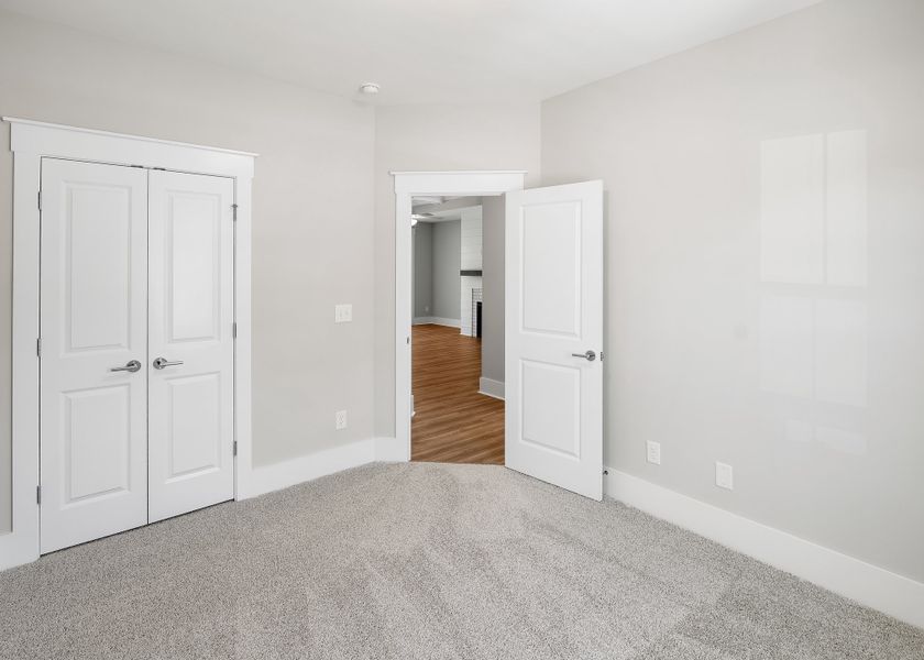 Representative unfurnished interior of a home built from the Birchwood by Bill Clark Homes in Osprey Landing, Southport (Image 28).