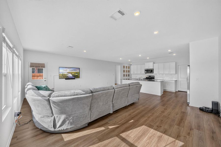 An open-concept living space integrates a well-appointed kitchen and a relaxed sitting area, ideal for daily living. An open-concept living space integrates a well-appointed kitchen and a relaxed sitting area, ideal for daily living.