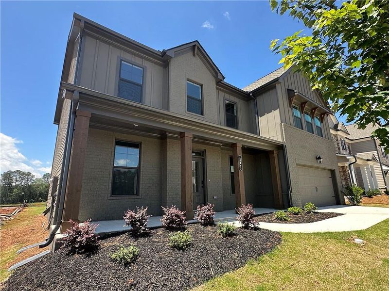 Front exterior of a new home in Summerlin, Winder, GA, highlighting curb appeal (Image 31). Front exterior of a new home in Summerlin, Winder, GA, highlighting curb appeal (Image 31).