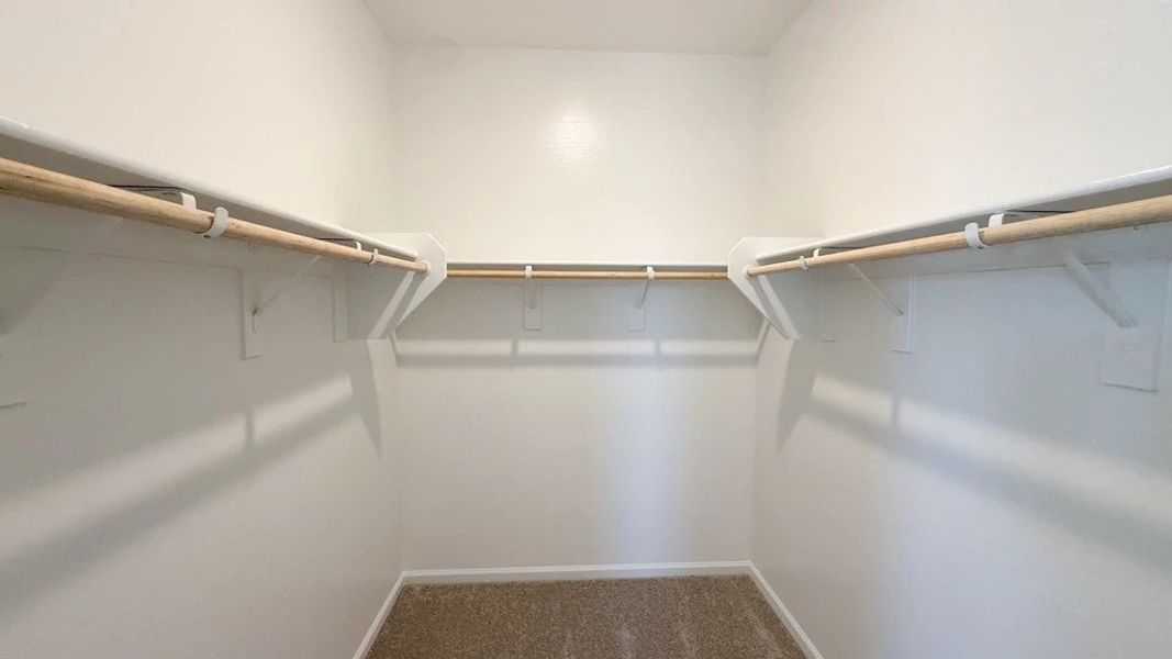 Primary walk in closet Primary walk in closet