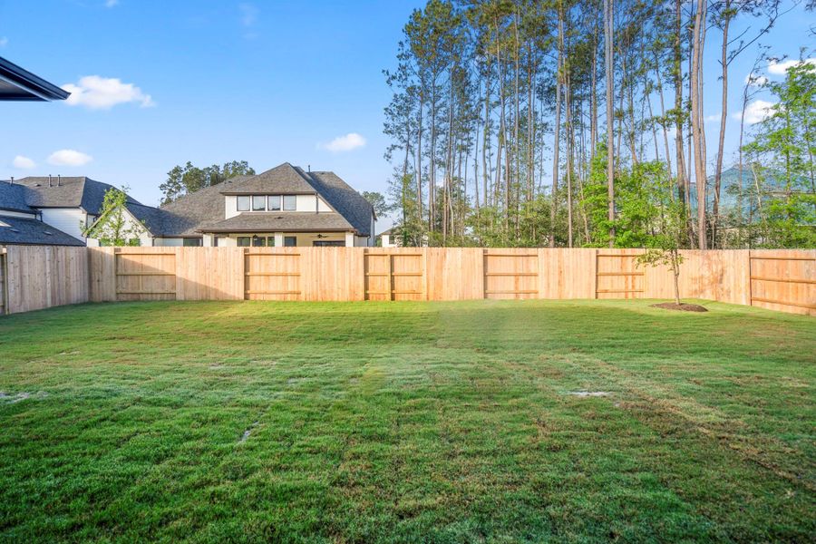 Exterior details and patio area of a home in ARTAVIA 70′ Lots, Conroe (Image 29).