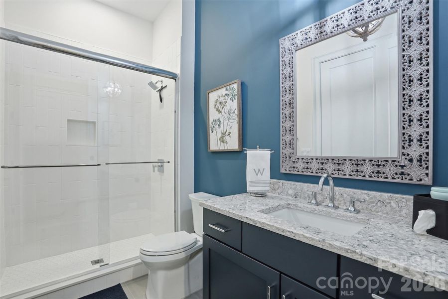 Full bath on main connected to office/bedroom