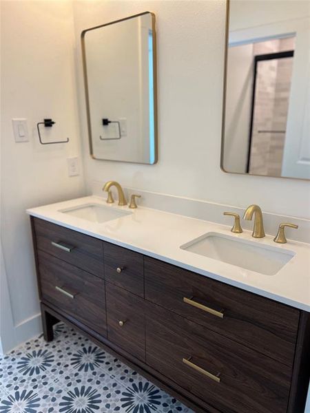 Bathroom with vanity and tile patterned floors